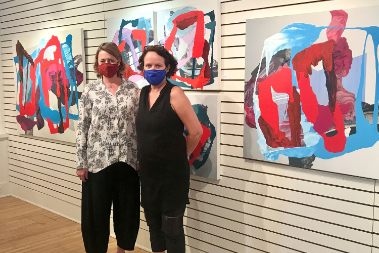 Two women pose inside a gallery at Creative Arts Group in Sierra Madre, CA.