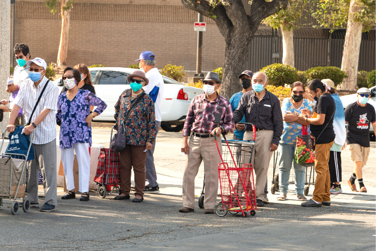 A line forms at a food distribution event in Pasadena, CA. 