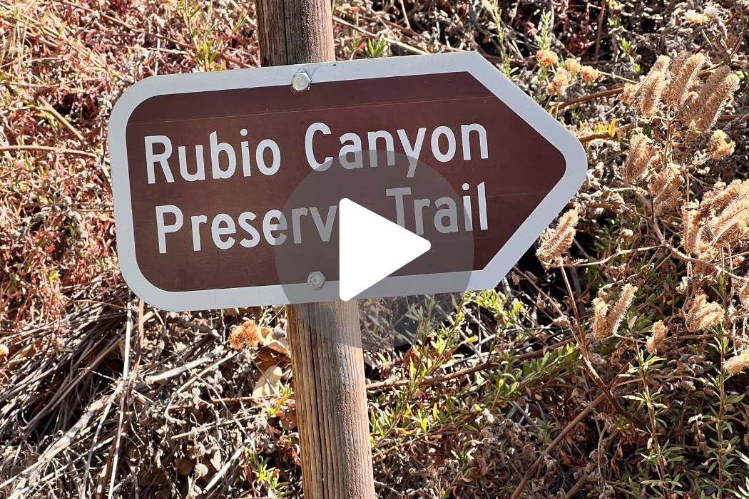 A rustic sign reads Rubio Canyon Preserve Trail