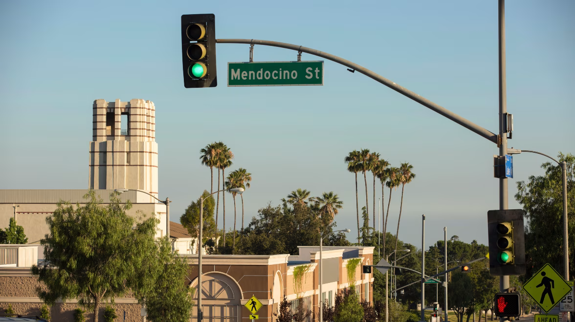A street scene shows a tower and a sign that reads Mendocino