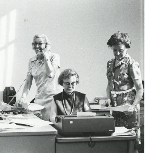 Black and white picture of 3 women volunteers