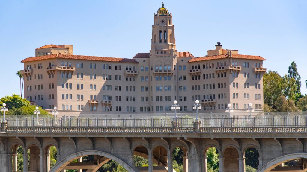 Hotel like building across from bridge