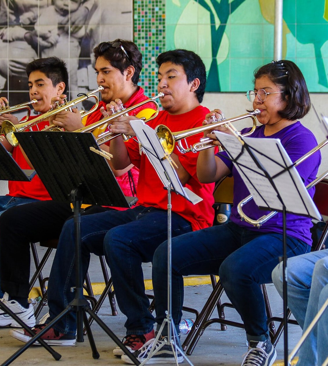 Student playing trumbone in music class