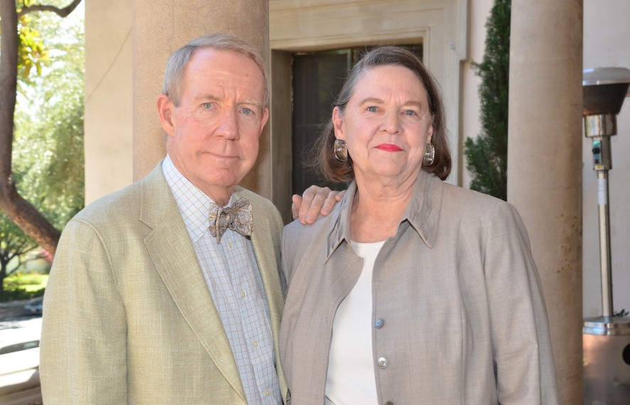Two people standing posing for photo