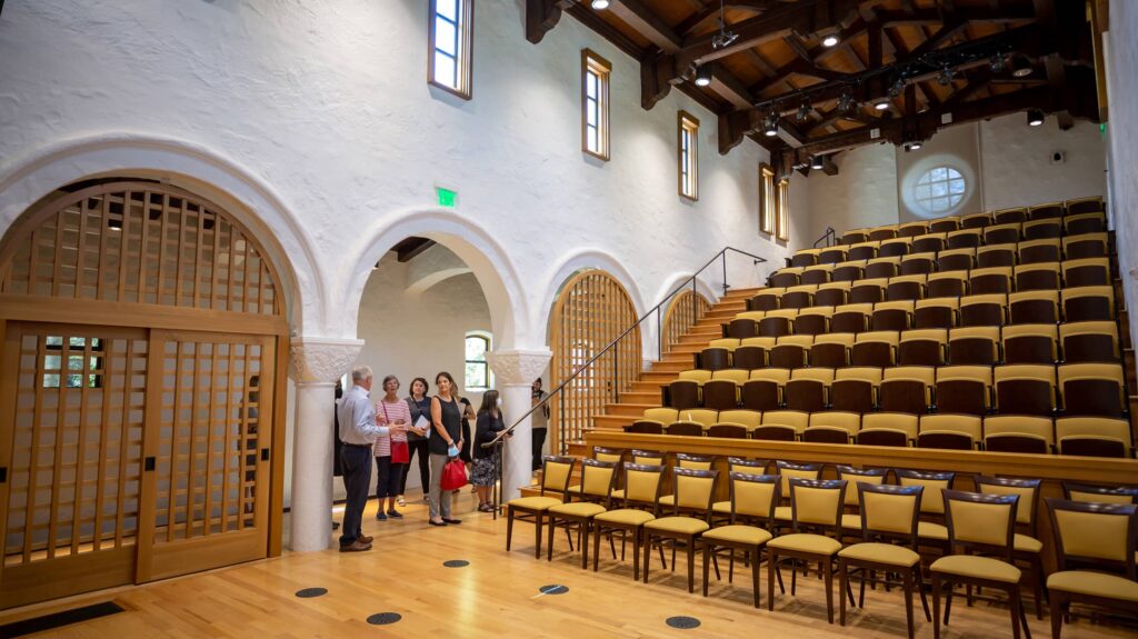Inside lecture room with rows of chairs