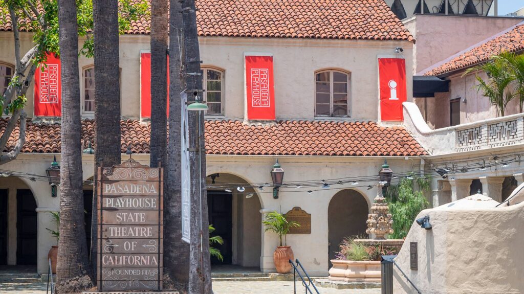 image of spanish architectural buidling with red banner flags