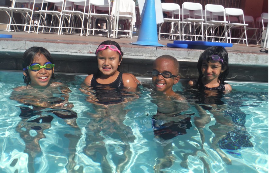 Kids smiling in the pool