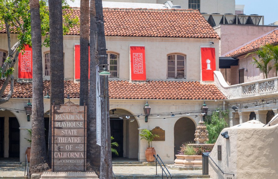 image of spanish architectural buidling with red banner flags