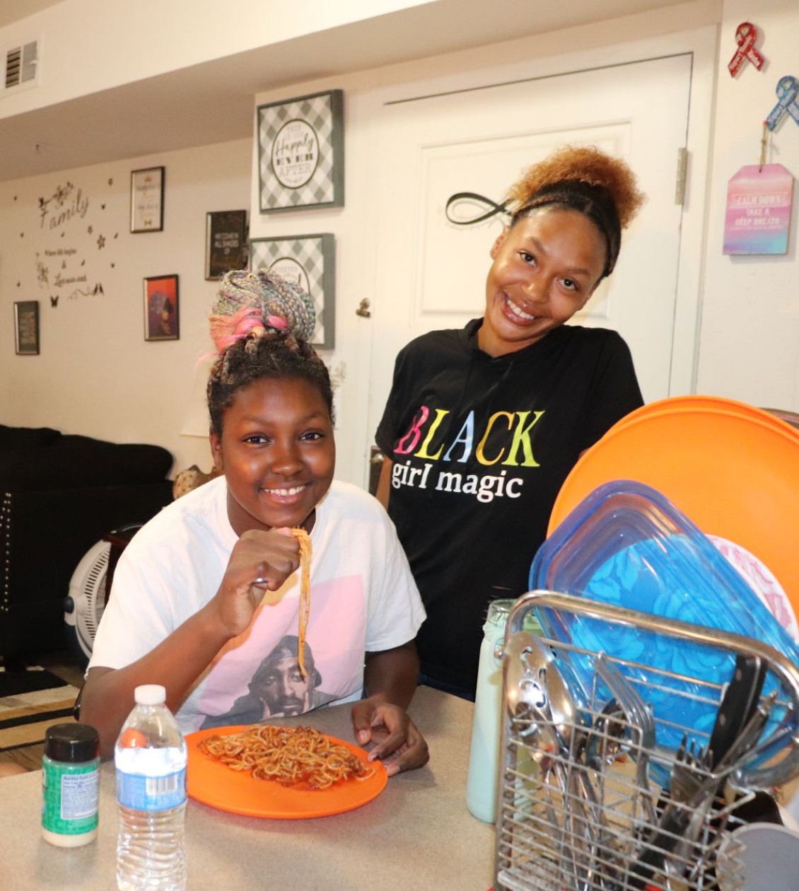 Young women eating at a kitchen counter