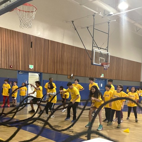 Kids in gym throwing rope
