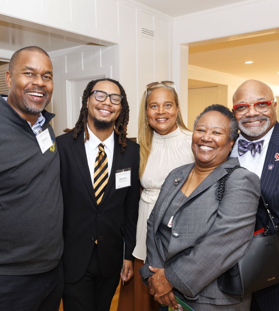 Group of attendees taking a photo together at an event