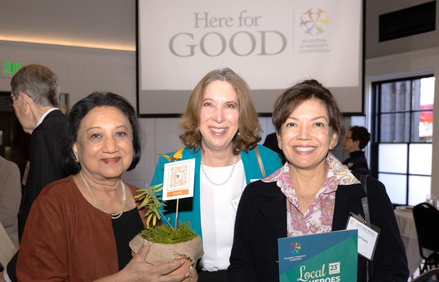 Three women taking a photo at a PCF event