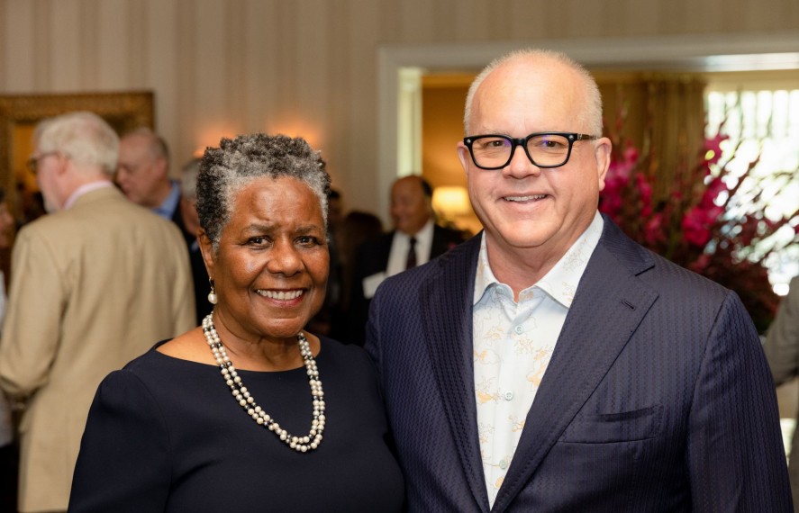 A man and woman taking a photo together at PCF event