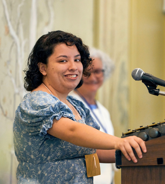 a young woman at a microphone