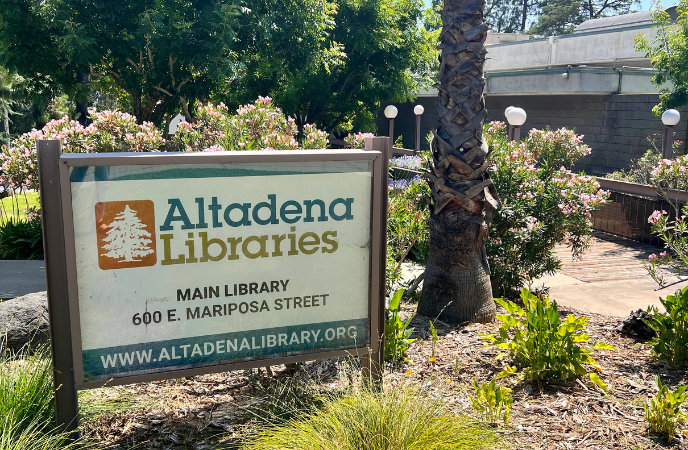 A sign outside a building reads Altadena Libraries