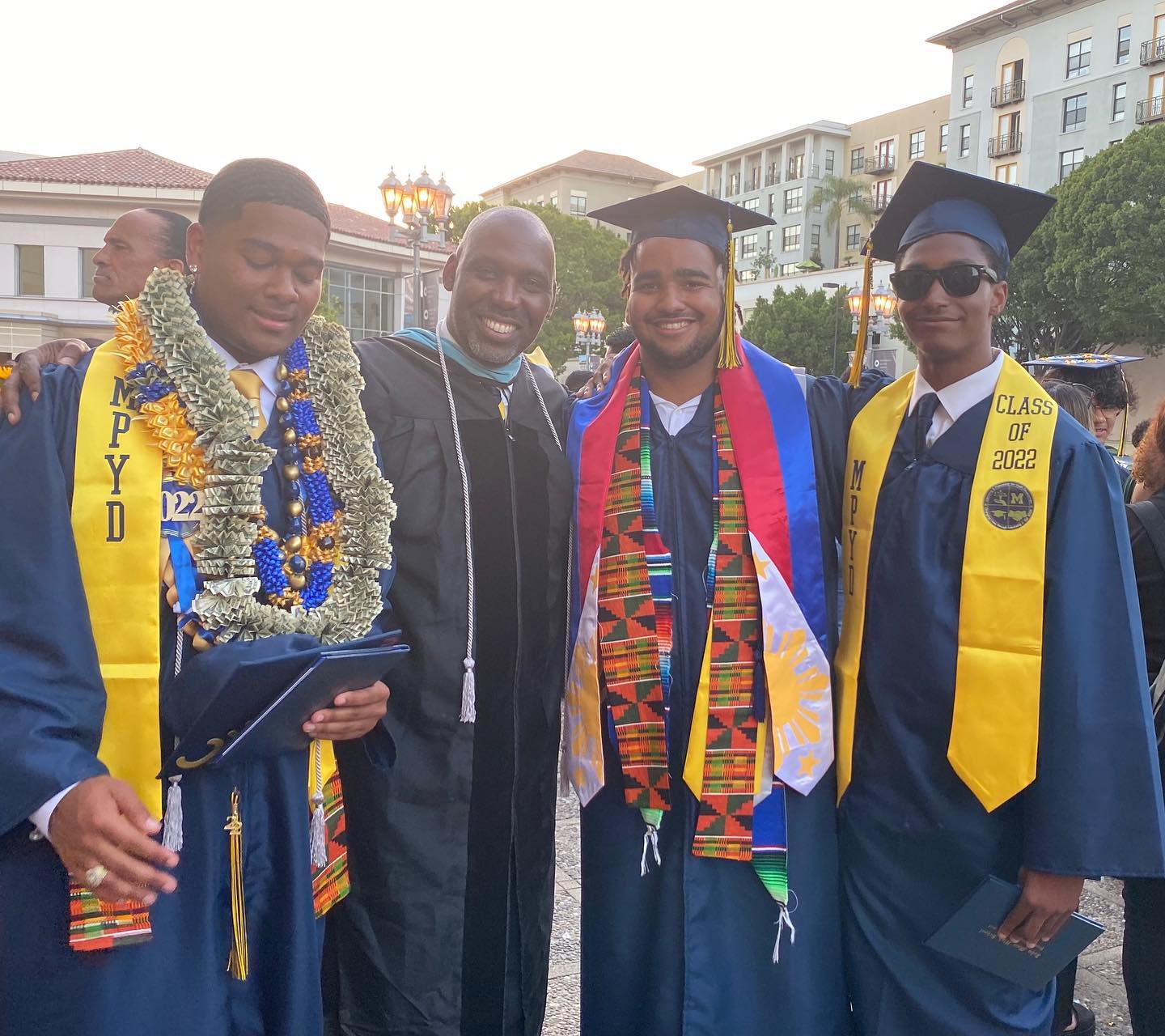 Four gentlemen graduating from high school