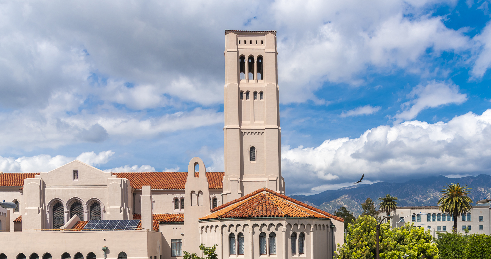 A Pasadena Church set against a brilliant blue sky and clouds