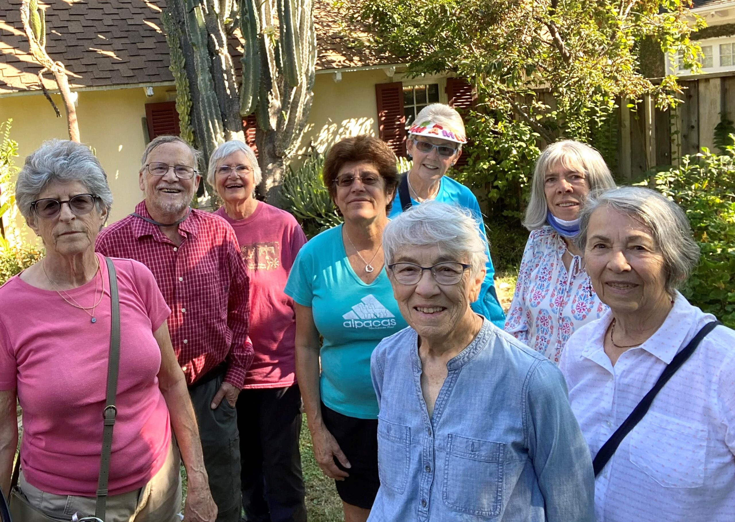 Eight seniors people looking at the camera