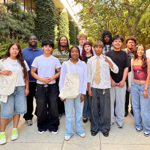 A group of young adults stand outdoors