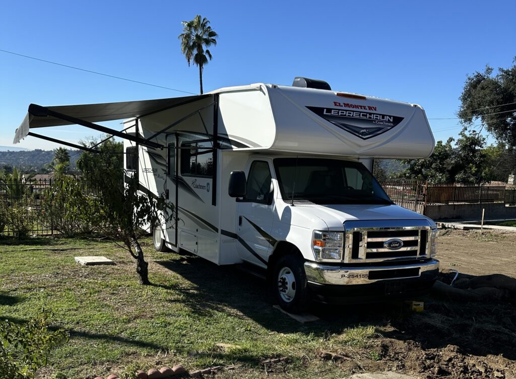 An RV with its shade awning out