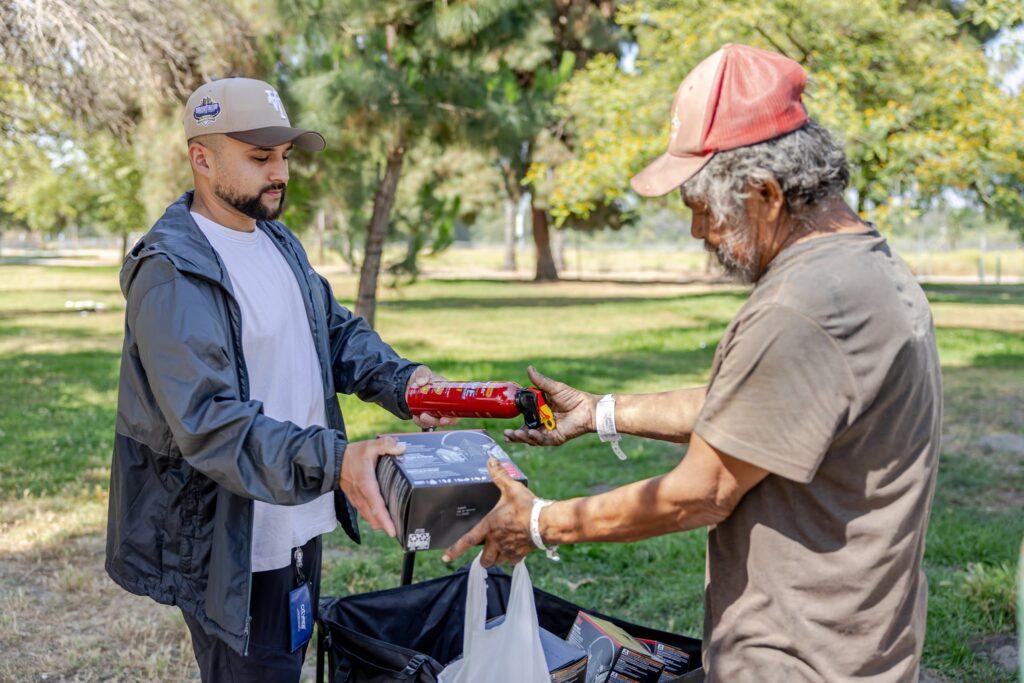 Two men exchange supplies.